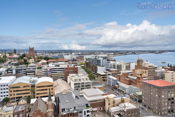 Air-conditioned apartment with city views, located across from Newcastle beach. - Photo 1