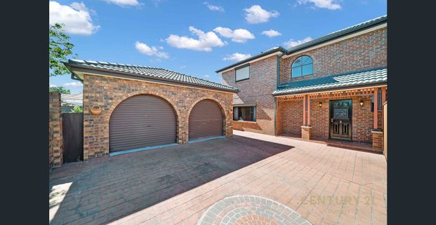 Stylish 4-Bedroom Home with Huge Garage and Family-Friendly Backyard - Photo 1