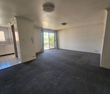 MODERN TWO BEDROOM APARTMENT IN A GATED COMMMUNITY - Photo 1