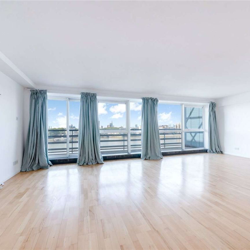 A two double bedroom duplex penthouse situated on the 6th and 7th floor of this charming gated riverside development located off Westferry Road. - Photo 1