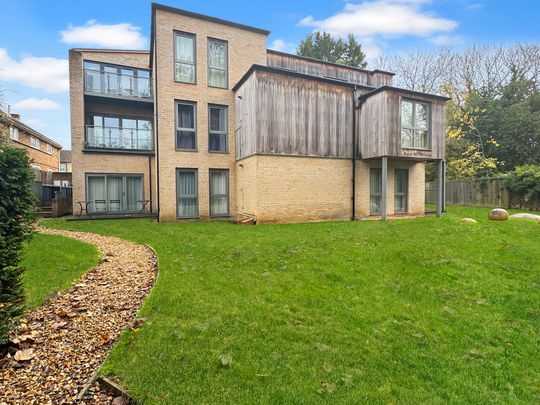 Situated along the High Street overlooking a private communal garden, this modern 2 bedroom flat offers a large balcony, open plan living/dining/kitchen area and allocated parking. - Photo 1