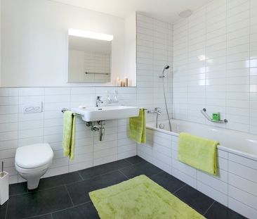 Moderne 4.5 Zimmer Attika Wohnung in familienfreundlicher Überbauung - Foto 3