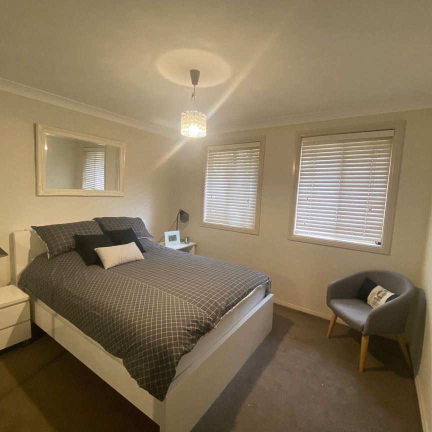 Move Straight in – Fully Furnished Coastal Townhouse Walk to Everything - Photo 1