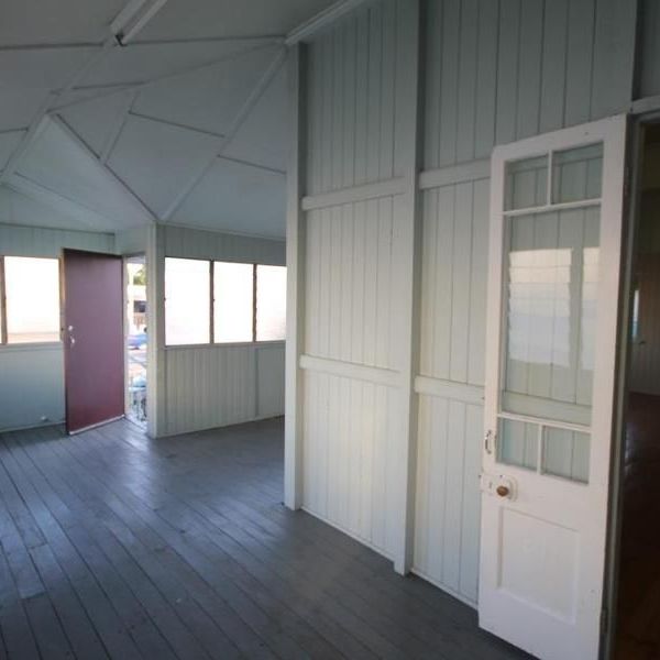 A SPACIOUS HIGH-SET HOME WITH 2 BEDROOMS PLUS ENCLOSED VERANDAS. - Photo 1