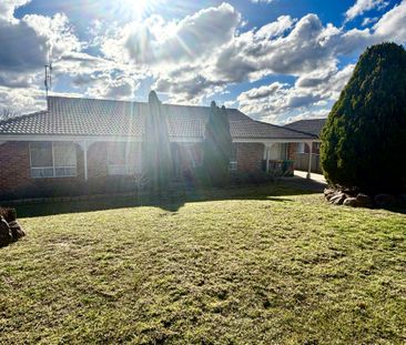Bright Family Home with Sunroom and Outdoor Living Space - Photo 5