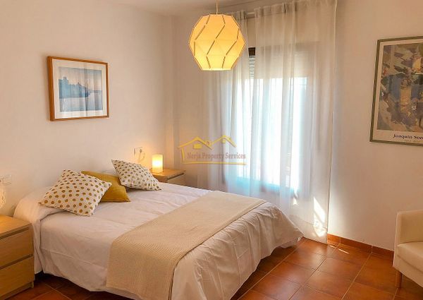 Bright 3-Bedroom Apartment with Parking and Pool, Available for Long-Term Rental in Frigiliana