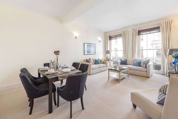 A bright two bedroom first floor apartment, boasting high ceilings and period features, situated in a handsome period building on sought after Motcomb Street. - Photo 1