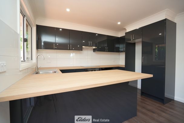 Convenient 2-Bedroom Unit with Low Maintenance - Photo 1