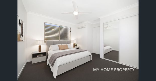 Freshly Painted Modern Apartment with New Carpet in Prime Location - Photo 1