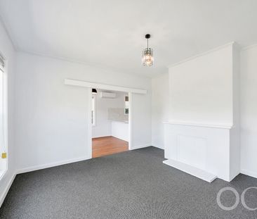 Open the door to coastal living with a sunlit deck retreat - Photo 4