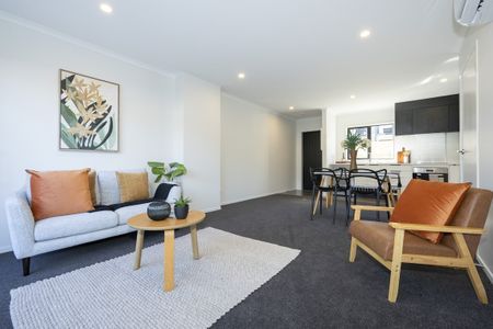 This contemporary two-bedroom, two-bathroom townhouse on Charlemont Street offers open-plan living with a modern kitchen, heat pump for year-round comfort. - Photo 2
