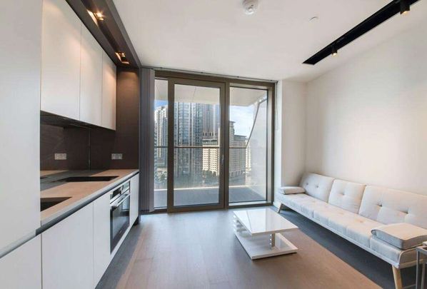 The studio apartment itself boasts an open-plan layout, providing a seamless flow between the living, dining, and sleeping areas. - Photo 1