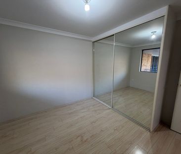 Spacious Top-Floor 2 Bedroom Unit with Lock-Up Garage & Balcony - Photo 2