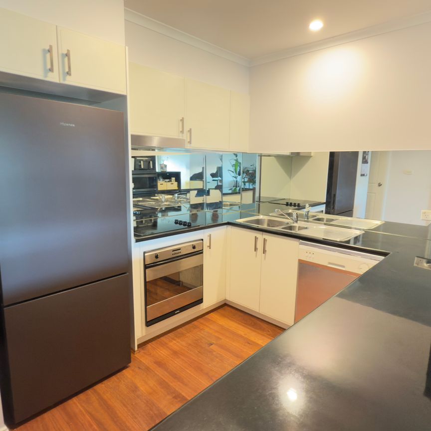 Top-Floor Serenity with Balcony Charm! - Photo 1