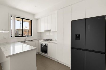 Charming Four Bedroom Family Home with Modern Comforts In A Prime Location - Photo 3