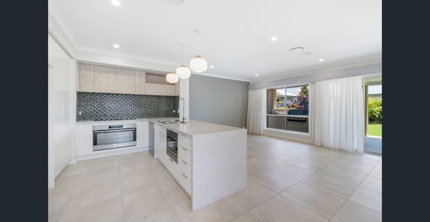 Stunning Family Home in Logan Reserve - Photo 1