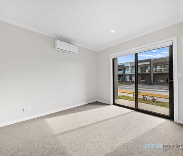 Stylish Two-Bedroom Townhouse with Light-Filled Living - Photo 1