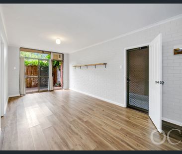 Open the Door to a Private Courtyard Retreat with Northern Light - Photo 1