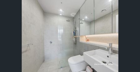 Spacious 2-Bedroom Unit in Shopping Village & Walk to Tallawong Metro - Photo 3