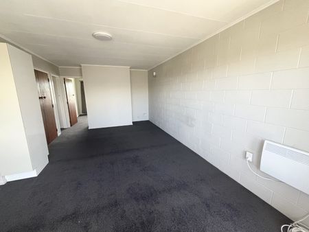Step into comfort and convenience with this upstairs unit, freshly updated with brand new carpet throughout. - Photo 5