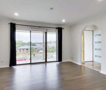 Renovated 3-Bedroom Home with Double Garage & Multiple Living Areas - Photo 2