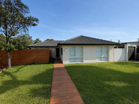 Freshly Updated Family Home with Flexible Living & Secure Parking - Photo 2