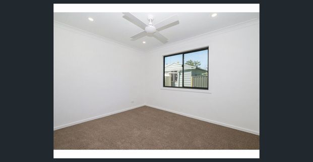 MODERN TWO-BEDROOM HOME WITH PRIVATE YARD IN CONVENIENT LOCATION - Photo 1