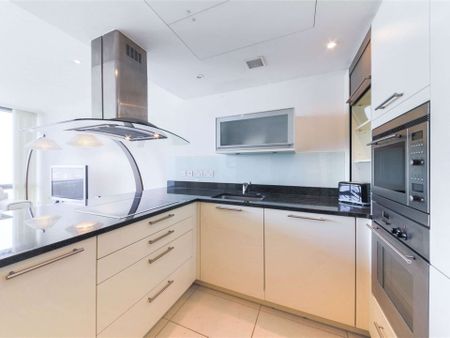 A bright 2 bedroom apartment situated on the 19th floor of this prestigious dockside development located close to the heart of Canary Wharf's business district. - Photo 3