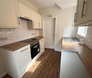 A three bedroom semi-detached family home with driveway parking and... - Photo 2