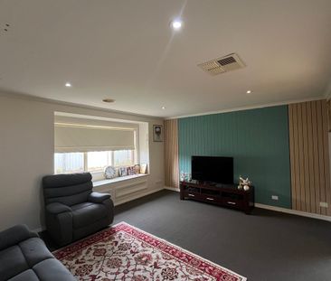 Modern 4-Bedroom Home with Multiple Living Areas - Photo 1