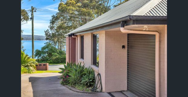 Coastal Retreat with Stunning Water Views - Photo 1