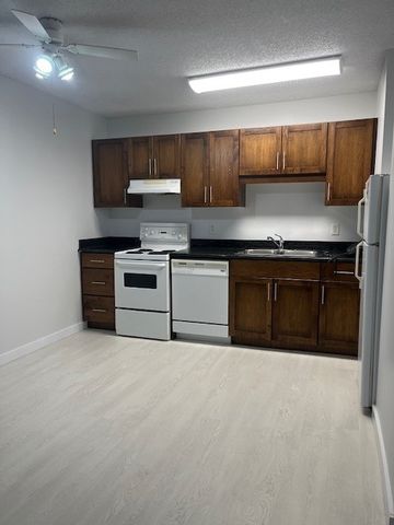 One Bedroom Rental Near Market Mall- New Flooring and Paint, with parking and dishwasher - Photo 2