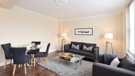 This fifth floor apartment is set over 728 sq ft approx and comprises of two double bedrooms, two modern bathrooms, reception room with rear facing views over Hay’s Mews. - Photo 2