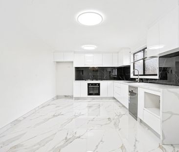 Modern Four Bedroom In a Convenient Location! - Photo 1