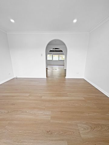 Renovated 3-Bedroom Home with Double Garage & Multiple Living Areas - Photo 3