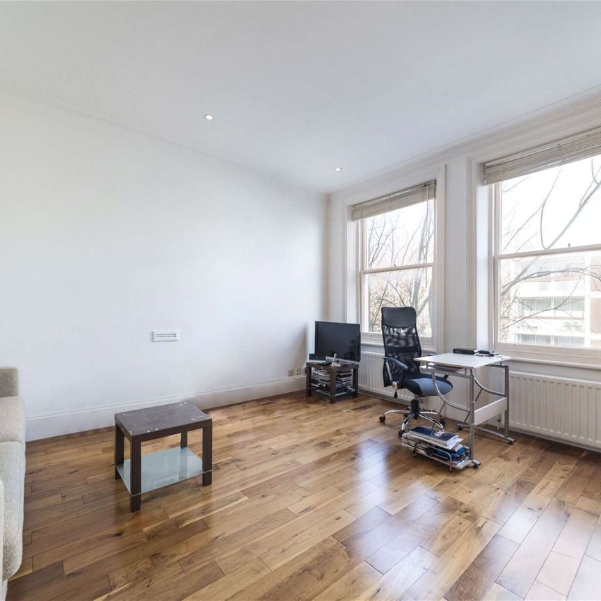 This is a charming two double bedroom property on a popular residential road in Baron's Court. - Photo 1