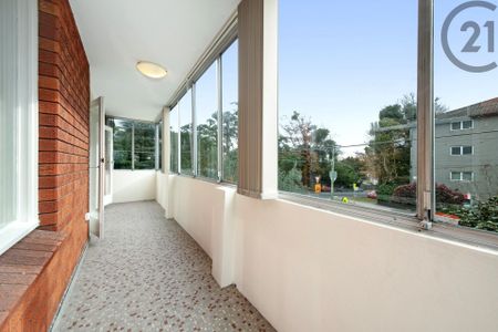 Large&comma; Sunfilled Apartment&comma; Sunroom&comma; Lock up Garage and Exceptional Value&period; - Photo 2