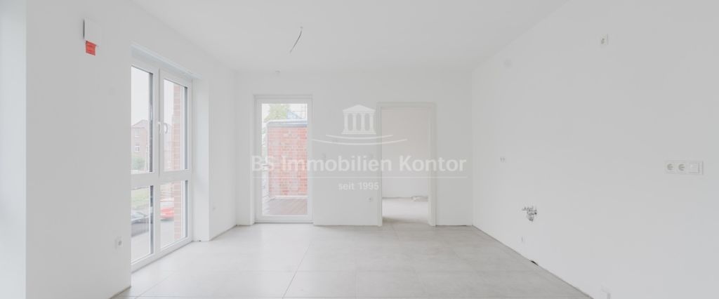 Moderne Obergeschosswohnung mit Balkon – Erstbezug im Stadtkern von Papenburg - Foto 1