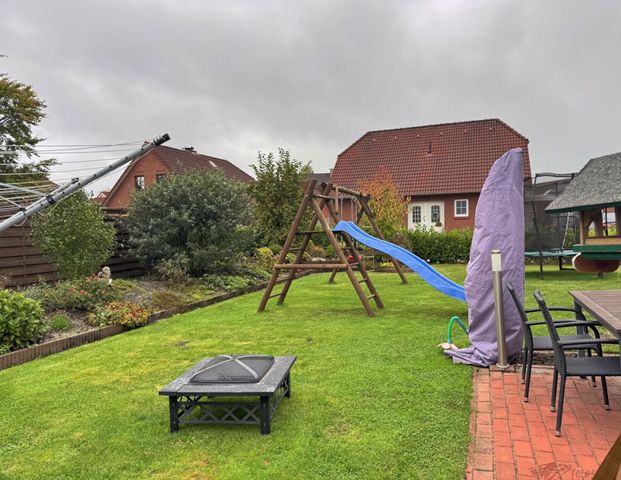 Gepflegte Doppelhaushälfte mit Garten, Garage & Carport in absolut zentraler Lage von Ostgroßefehn - Foto 1