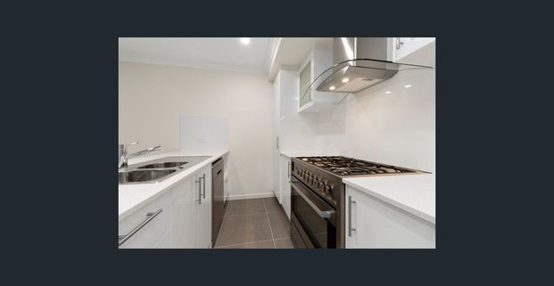 Modern 4BR Family Home in Logan Reserve (Pets Allowed) - Photo 1