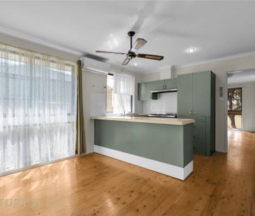 Charming Three-Bedroom Home - Photo 2