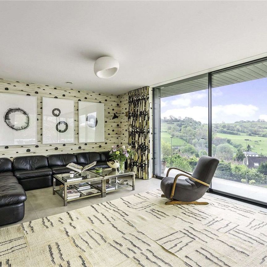 An exceptional contemporary home with quality interiors and landscaped gardens in an elevated position with village and open country views. - Photo 1