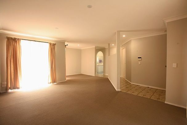 Neat and tidy Family Home- with a perfect yard - Photo 1