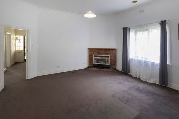 This beautifully presented, spacious three-bedroom home is ideally positioned in a highly sought-after location. - Photo 1