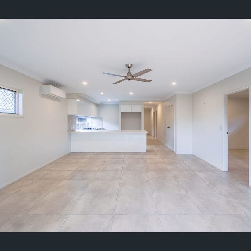 LOW MAINTENANCE FAMILY HOME, READY TO MOVE IN AND ENJOY A RELAXED LIFESTYLE! - Photo 1