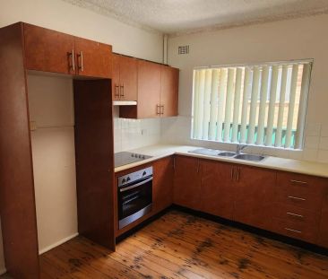 CONVENIENTLY LOCATED TWO BEDROOM UNIT - Photo 2