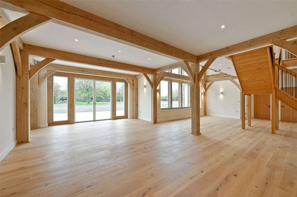 A grand oak-framed country home with vaulted ceilings and striking architectural detail - Photo 1