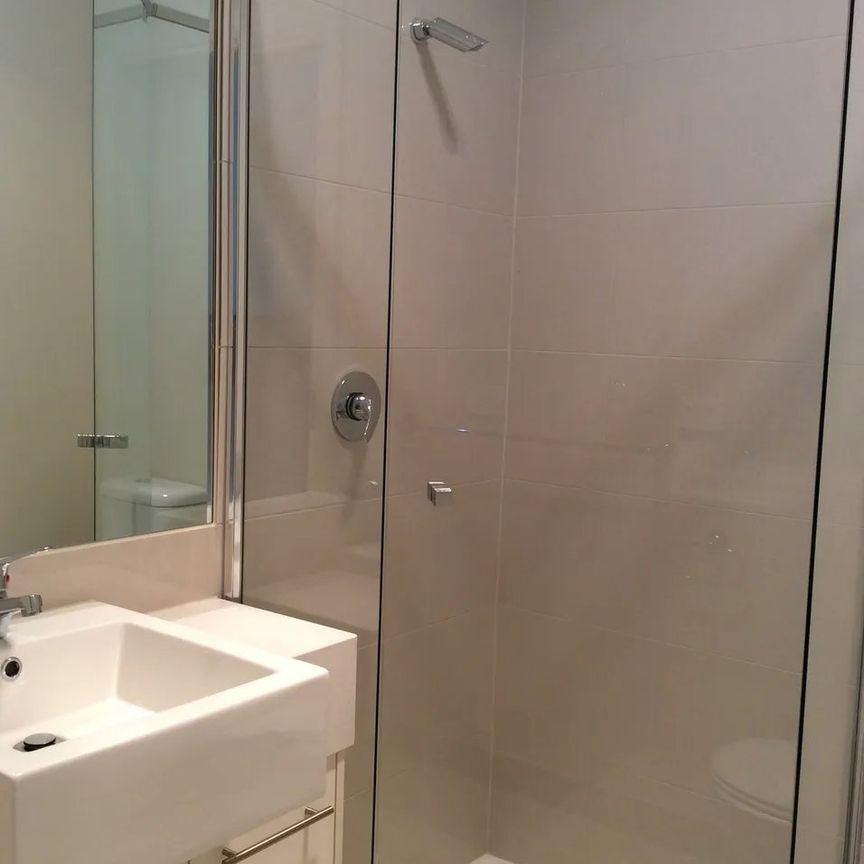 Register to Inspect // Stylish Two-Bedroom Townhouse with Dual Living Spaces - Photo 1