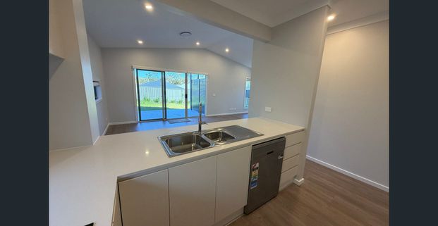 BRAND NEW, IMPRESSIVE 3-BEDROOM HOME! - Photo 1