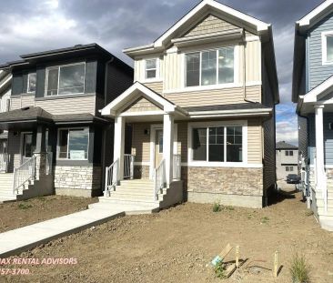 UPPER 1052 14 Avenue Northwest — Detached House - Photo 1